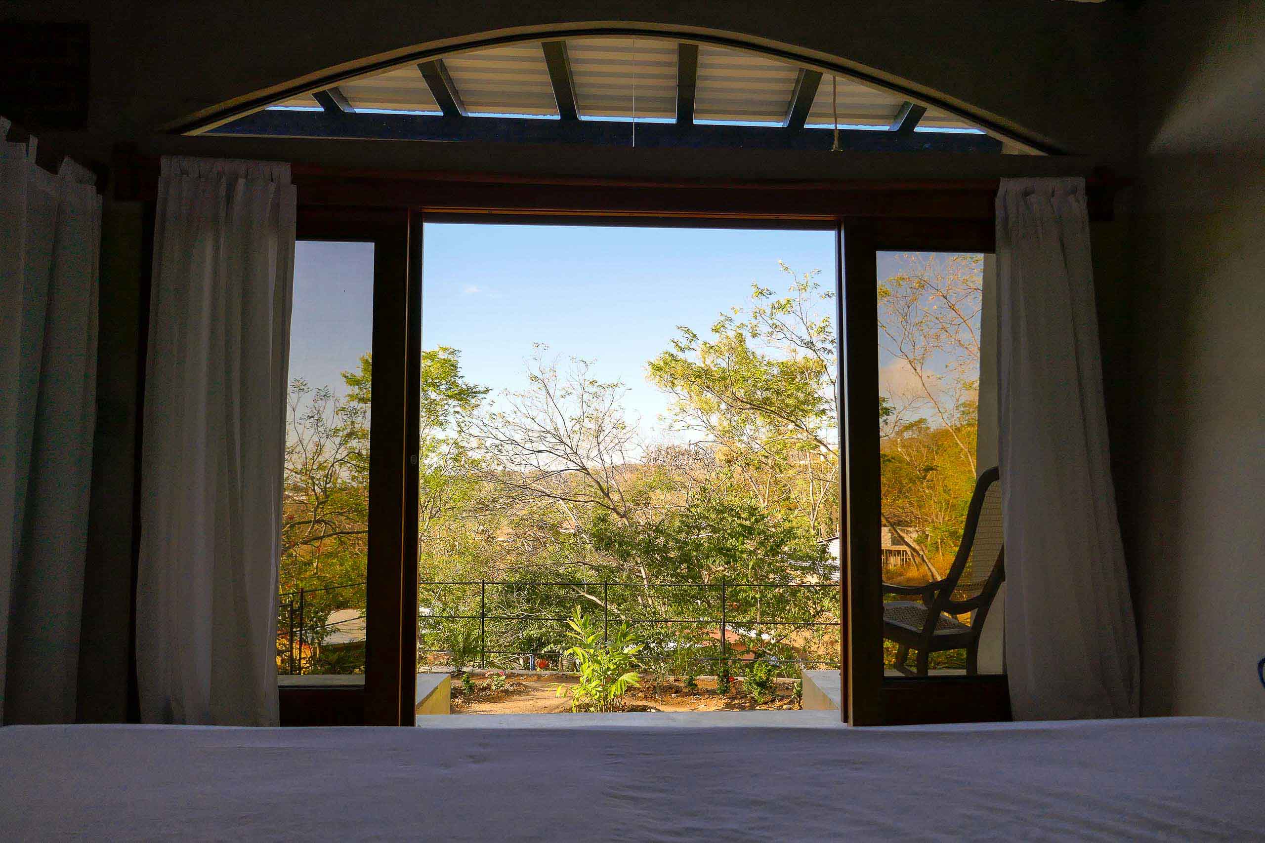 Casa Oro Group Casa-Andalucia-Retreat-Nature-San-Juan-Del-Sur-Nicaragua-Bed-Balcony-Ocean-View-King-Room-Sacramonte-Suite-Earth-Construction-Biotecture Casa Andalucia 