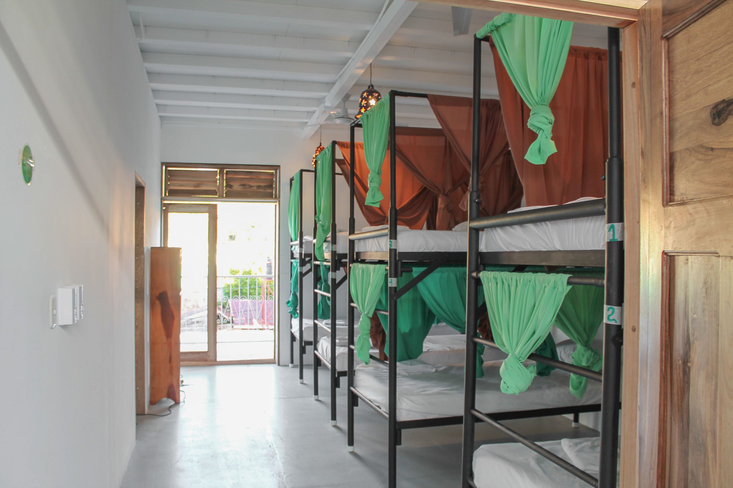 Casa Oro Group Casa-Oro-Eco-Hostel-San-Juan-del-Sur-Nicaragua-Deluxe-Dormitory-Privacy-Curtain-Balcony-Hospitality Casa Oro Group Casa-Oro-Eco-Hostel-San-Juan-del-Sur-Nicaragua-Deluxe-Dormitory-Privacy-Curtain-Balcony-Hospitality Casa Oro Eco Hostel