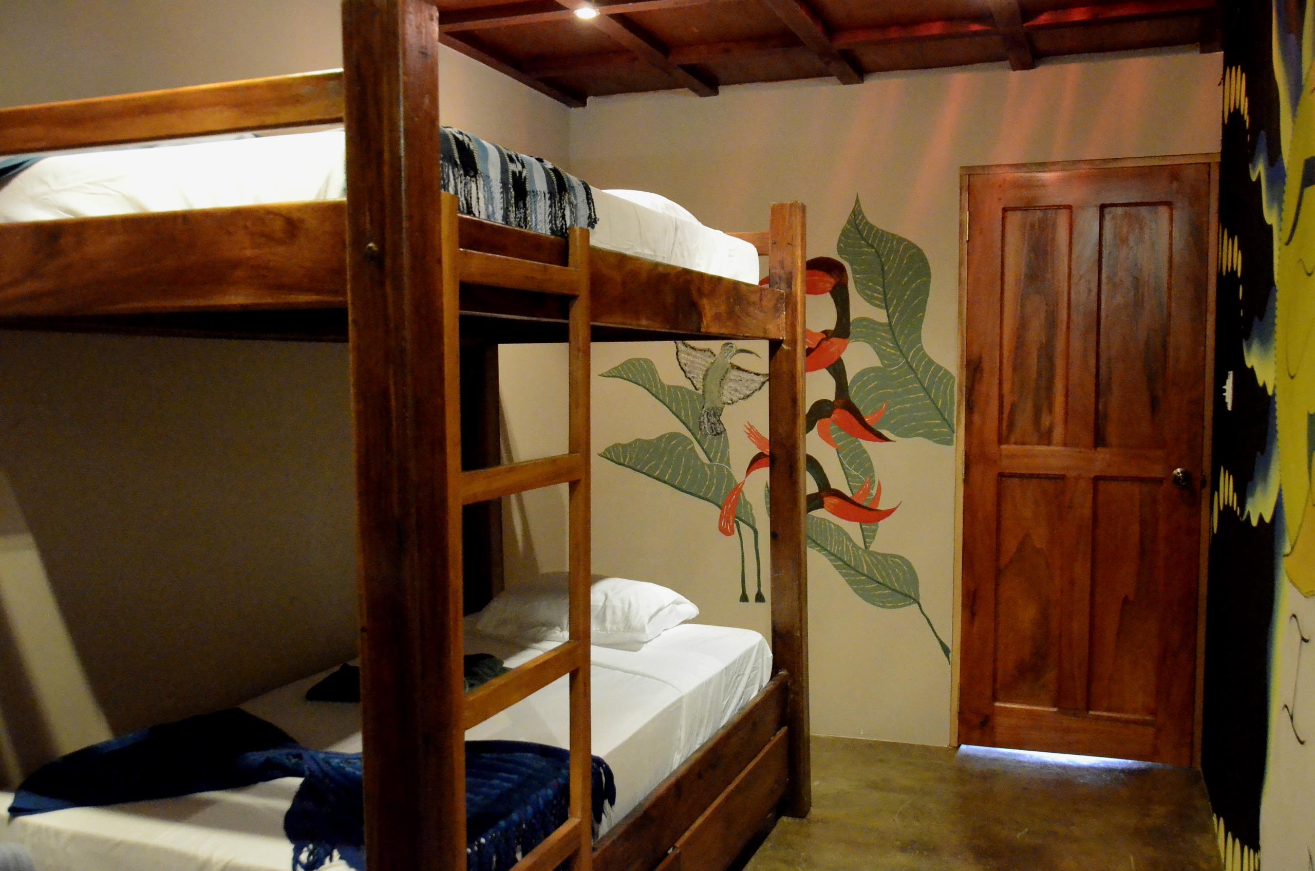 Casa Oro Group Nuestra-Casa-Eco-Guesthouse-San-Juan-Del-Sur-Nicaragua-Amor-Bunk-Room-Budget-Art-Comfortable-Wood-Furniture Nuestra Casa 