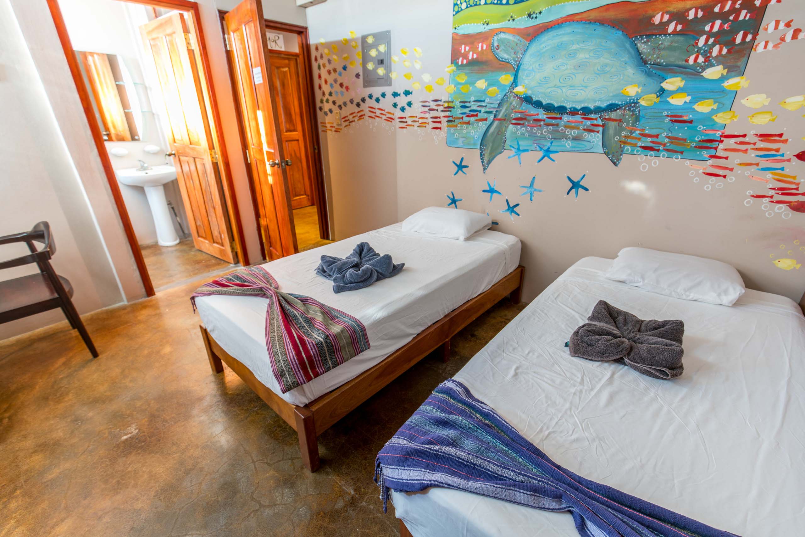 Casa Oro Group Nuestra-Casa-Eco-Guesthouse-San-Juan-Del-Sur-Nicaragua-Tortuga-King-Room-Twin-Beds-Art-Organic-Textile-Responsible-Travel Nuestra Casa 